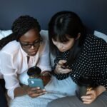 photograph of friends looking at a cell phone